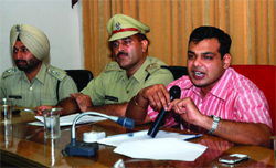 SSP Ashish Chaudhary (right) along with senior police officials addressing a press conference in Bathinda on Friday.