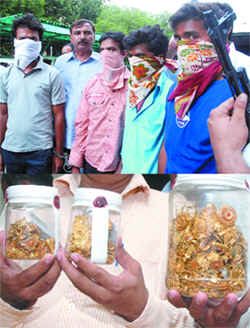 Four persons arrested for stabbing and robbing a jeweller and his son in Gujarat, in New Delhi on Friday. 