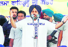 Deputy CM Sukhbir Badal addresses a gathering at Chhapar Mela near Mandi Ahmedgarh on Friday.