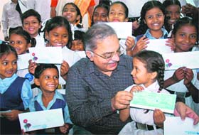 Ajay Swaroop, Chief General Manager, State Bank of India, along with the girls adopted by the bank in Chandigarh