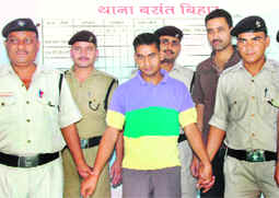 Vikram Singh, an accused in the Sudhir Rawat case, in police custody in Dehradun on Saturday.