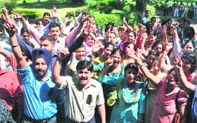 Members of the Contractual Teachers Association protest at Science College in Jammu