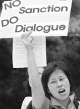 An anti-war activist chants a slogan during a rally denouncing the US policy towards North Korea in Seoul