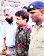 The accused in the police custody in Chandigarh on Sunday.