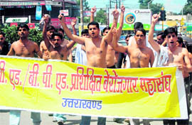 Activists of BEd Trained Unemployed Association hold a protest demonstration in Dehradun on Sunday.