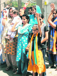 Various political parties bring kids to protest over the central university issue in Jammu on Sunday.