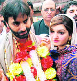 Jammu Kashmir Liberation Front chairman Yaseen Malik and his wife, Mushaal Mullick, on arrival in Srinagar on Sunday.