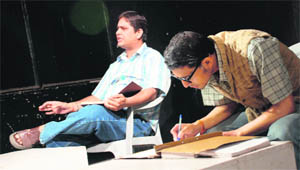 A scene from Balwant Thakur-directed play Diary Ek Lok Nath Ki staged in Jammu on Sunday.