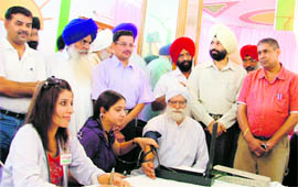 Doctors examine a patient at a free medical check-up camp organised in Ludhiana on Sunday.