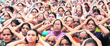 Women from Jain community attend a prayer meeting for world peace at Gandhinagar in Gujarat on Sunday.