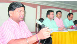 Harish Chander, president, FCIOA, and Regional Manager, FCI, addresses a meeting in Ludhiana on Sunday. 
