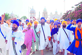 Radical Sikhs, led by Baljeet Singh Daduwal, march from Takht Damdama Sahib to hand over a memorandum to the Bathinda Deputy Commissioner at Talwandi Sabo on Sunday. 