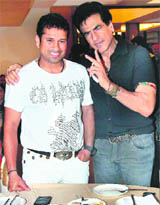 Sachin Tendulkar with actor Jitendra (R) at a programme in Mumbai on Saturday.