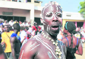 A participant attends the Homowo traditional festival at Teshie community in Ghanas capital, Accra, on Saturday. Homowo festival marks the beginning of a new harvest and is celebrated by the Ga people around the coastal regions of Ghana. 