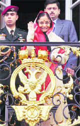 President Pratibha Patil acknowledges visitors from a balcony during her visit to the Peterhof palace in St. Petersburg, Russia, on Sunday.
