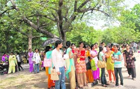 Girls wait in the sun for a bus outside Government College for Girls, Sector 11, Chandigarh
