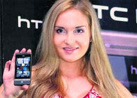 A model poses with HTC Hero, the worlds first android-based phone at its launch in New Delhi