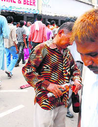 Members of the BKU having liquor before the rally in Sector 16 on Tuesday.