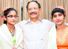 Former Chief Minister BC Khanduri with Renu Saklani (L) and Anjana Juyal at his residence in Dehradun on Tuesday.