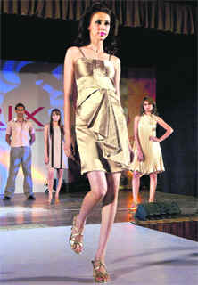 A model walks down the ramp during a hairdressing show in Ludhiana on Tuesday.