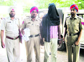 The accused in police custody at Khanna on Tuesday. 