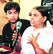 Shamima Kausar, mother of 19-yr old Ishrat Jahan who was killed in an encounter, along with her son addresses a press conference in Thane, Mumbai, on Tuesday.