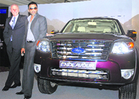 Bollywood actor Suniel Shetty and Michael Boneham, president and managing director, Ford India, at the launch of new Ford Endeavour in New Delhi on Wednesday. The car is priced between Rs 15.99 lakh and 17.99 lakh (ex-showroom, New Delhi).