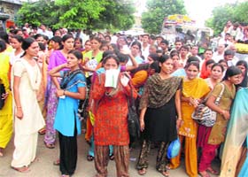 Students of DAV Mahila College block traffic on the Rewari-Kosli road in Kosli