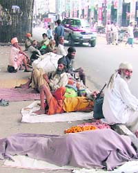 With nowhere to go, beggars sit on a footpath in Ludhiana