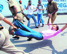 Policemen take an agitating student in custody in Amritsar on Wednesday.