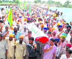 The body of Jagsir Singh being taken to the cremation ground at Chanarthal village on Wednesday.