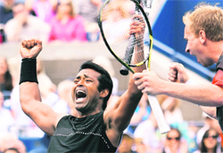 Leander Paes and Lukas Dlouhy (R) celebrate after defeating Bob and Mike Bryan on Wednesday. 