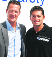 Ferrari F1 driver Giancarlo Fisichella (R) and Michael Schumacher during a meeting to promote advanced vehicle safety technologies at Campagnanos Vallelunga, race track, near Rome, on Tuesday. 