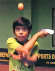 Ishu of DAV Public School in action during a table tennis tournament at Sector 23, Chandigarh, on Thursday. 