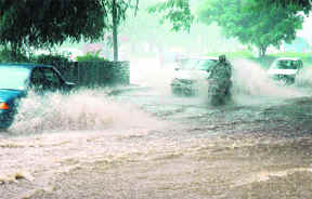 Rainwater accumulates on a road following showers in Chandigarh on Thursday.