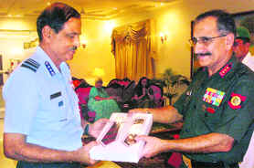 Lt Gen TK Sapru, GOC-in-C, Western Command, (right) receives a soveniour from Air Marshal NAK Browne, AOC-in-C, Western Air Command, in Chandimandir on Thursday. 