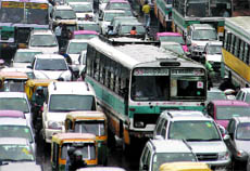 Vehicles crawl at ITO in New Delhi on Thursday.
