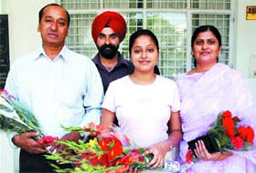 Kiranjit Kaur with her parents after the felicitation function at Lyallpur Khalsa College in Jalandhar
