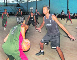 Players vying for the ball during a basketball match at the Guru Nanak Stadium in Ludhiana on Thursday. 