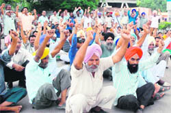 PSEB employees stage a dharna in front of Guru Nanak Dev Thermal Plant in Bathinda on Thursday