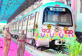 Security personnel stand guard beside a newly launched standard gauge metro car at a Bharat Earth Movers Limited (BEML) factory in Bangalore on Friday. BEML has manufactured the first-ever standard guage metro cars at their Bangalore factory. 