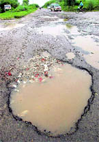 The road separating Sector 49, Chandigarh, and Phase X, Mohali,in a poor condition.
