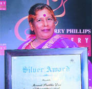 Prtibha Devi with the Godfrey Phillips Bravery Award in New Delhi on Friday.