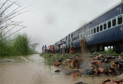 A stranded train on an inundated railway track at Paatli village in Gurgaon on Friday.