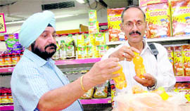 Dehradun Municipal officials confiscate expiry date cold drinks at Vishal Mega Mart in Dehradun on Friday.