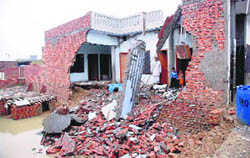  A house in Shiv Colony in Karnal, which was damaged due to heavy rain on Friday.