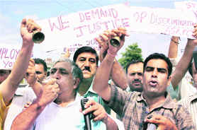 Kashmiri Pandits hold a protest against the government over their plight in Jammu on Friday.  PTI