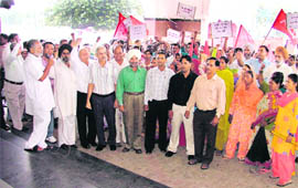 Activists of the CPI and CPM stage a protest against hike in power tariff and rising prices in Ludhiana on Friday.