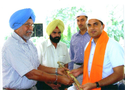 Ferozepur Deputy Commissioner KK Yadav being given a siropa at a function organised to commemorate Saragarhi Day on Saturday.