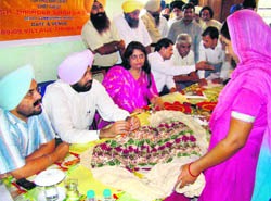 Patiala Deputy Commissioner Deepinder Singh at a handicraft workshop in Thuha village near Rajpura on Saturday.